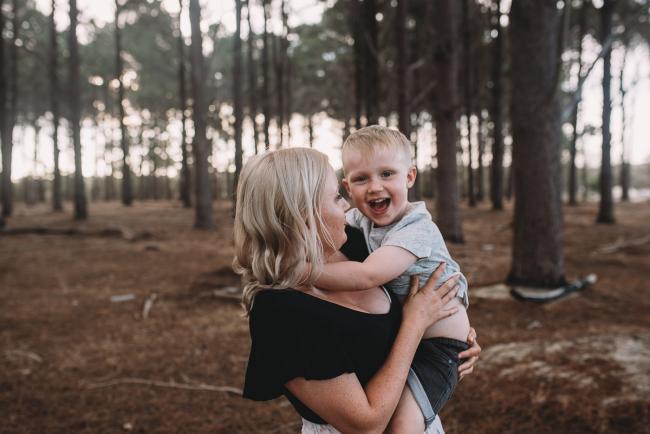 Family-Photographer-Perth-The-Pines-3-of-29 Mother holding son during Perth family photography session at The Pines Wanneroo