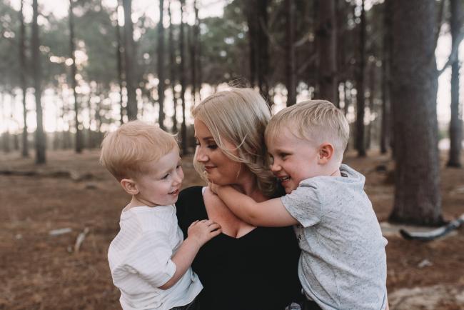 Family-Photographer-Perth-The-Pines-6-of-29 Mother holding two boys during Perth family photography session at The Pines Wanneroo
