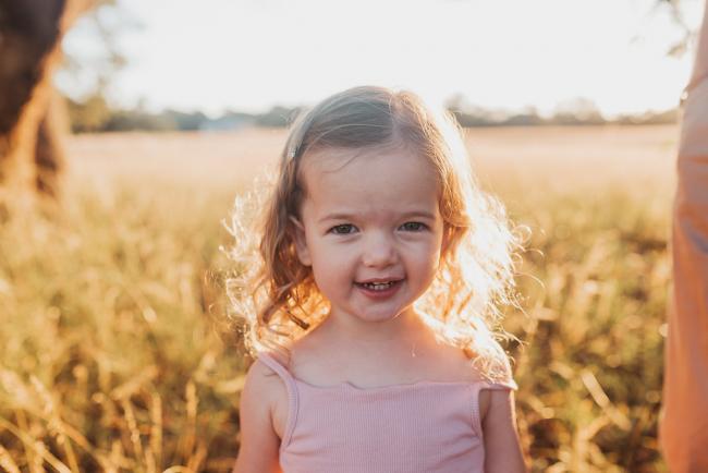 Little girl during Perth maternity photography session during golden hour at Perry's Paddock