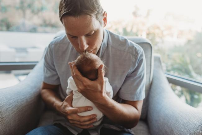 Newborn-Lifestyle-Photographer-Perth-12-of-50 Father kissing newborn baby during Perth lifestyle newborn photography session