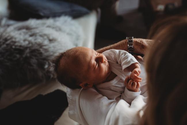 Newborn-Lifestyle-Photographer-Perth-50-of-50 Newborn baby in arms during Perth lifestyle newborn photography session