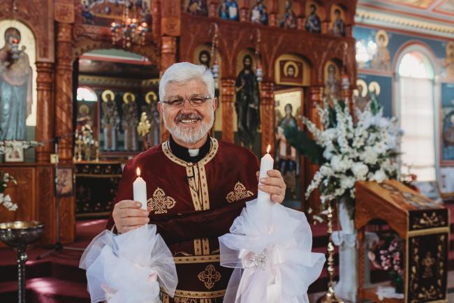 Perth-Events-Photographer-Christening-14-of-25 Priest with candles at baptism at Macedonian Orthodox Church with Perth events photographer
