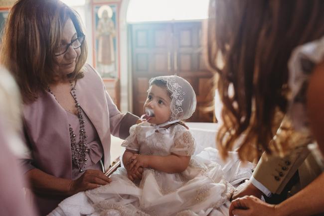 Perth-Events-Photographer-Christening-15-of-25 Little girl in bonnet at baptism at Macedonian Orthodox Church with Perth events photographer