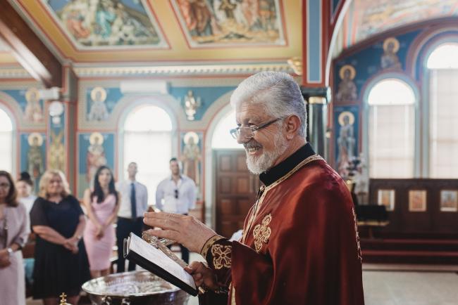 Perth-Events-Photographer-Christening-17-of-25 Priest smiling at baptism at Macedonian Orthodox Church with Perth events photographer