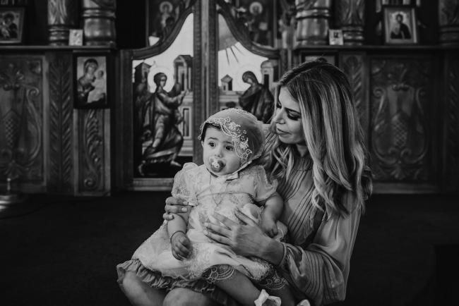Perth-Events-Photographer-Christening-19-of-25 Black and white image of mother and daughter at baptism at Macedonian Orthodox Church with Perth events photographer