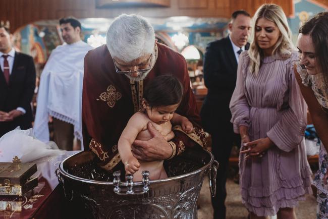 Perth-Events-Photographer-Christening-8-of-25 Little girl being baptised in water at baptism at Macedonian Orthodox Church with Perth events photographer