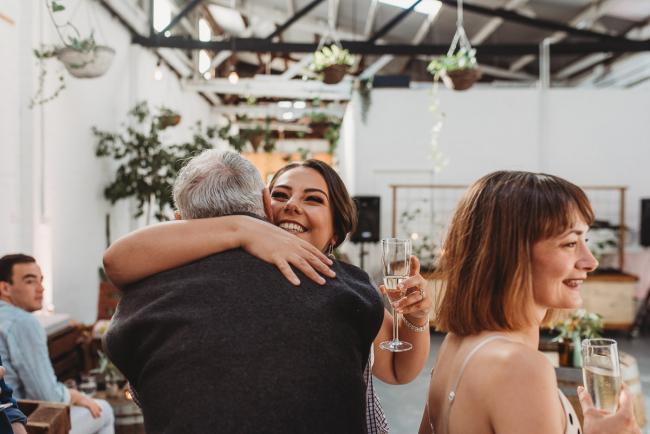People hugging during a party at Cleaver St Event Space with Perth events photographer