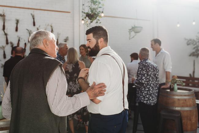 Men talking during a party at Cleaver St Event Space with Perth events photographer