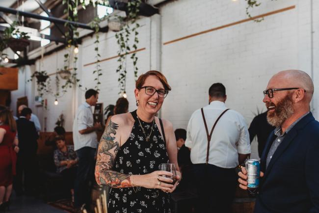 Man and woman laughing during a party at Cleaver St Event Space with Perth events photographer