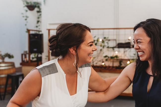 Women laughing during a party at Cleaver St Event Space with Perth events photographer