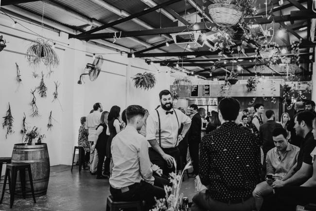 Black and white image of room during a party at Cleaver St Event Space with Perth events photographer