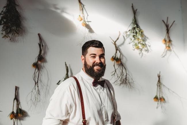 Man smiling at the camera during a party at Cleaver St Event Space with Perth events photographer