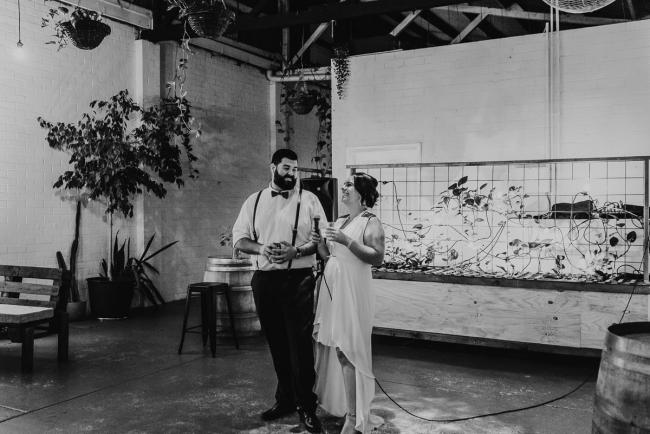 black and white image of couple giving speech at Cleaver St Event Space with Perth events photographer
