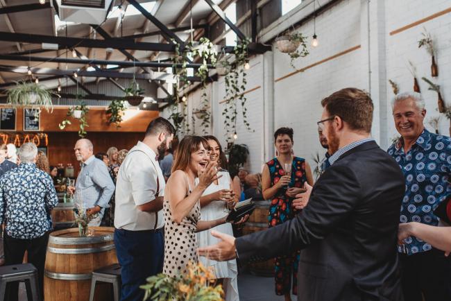 People greeting each other during a party at Cleaver St Event Space with Perth events photographer