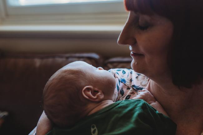 Profiles of newborn baby and mother during in-home Perth newborn lifestyle photography session