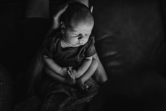 black and white image of newborn baby sleeping during newborn photography Perth session