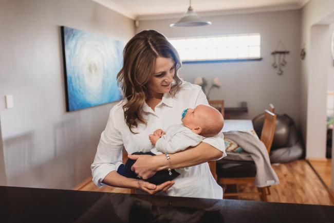 Mother holding baby with Perth Newborn photographer Alana Prosper Photography
