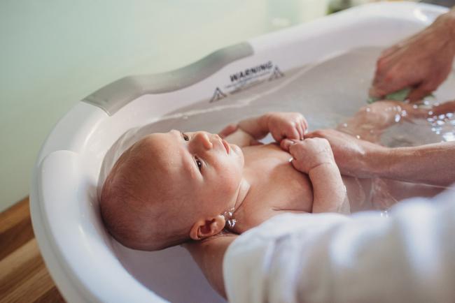 Baby in bath with Perth Newborn photographer Alana Prosper Photography