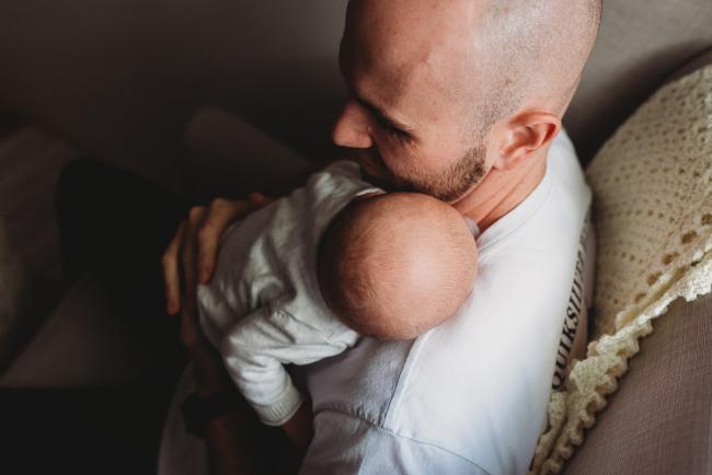 Baby on father's shoulder with Perth Newborn photographer Alana Prosper Photography