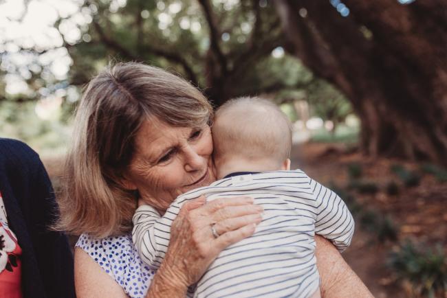 Baby cuddling grandmother during extended family session at Hyde Park with Perth family photographer Alana Prosper Photography