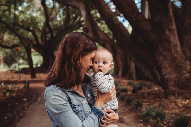 mother leaning head against baby during extended family session at Hyde Park with Perth family photographer Alana Prosper Photography