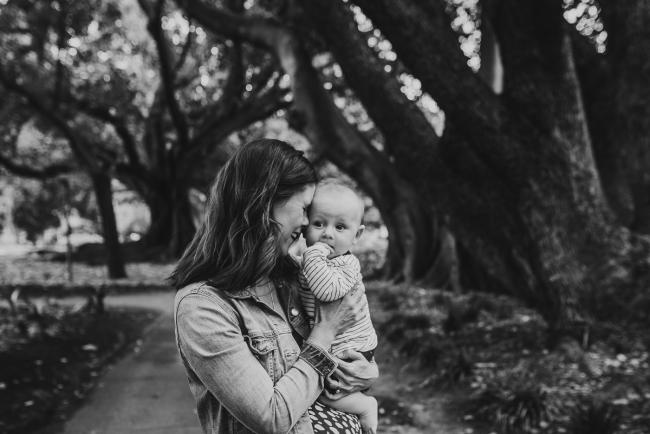 black and white image of mother and baby during extended family session at Hyde Park with Perth family photographer Alana Prosper Photography