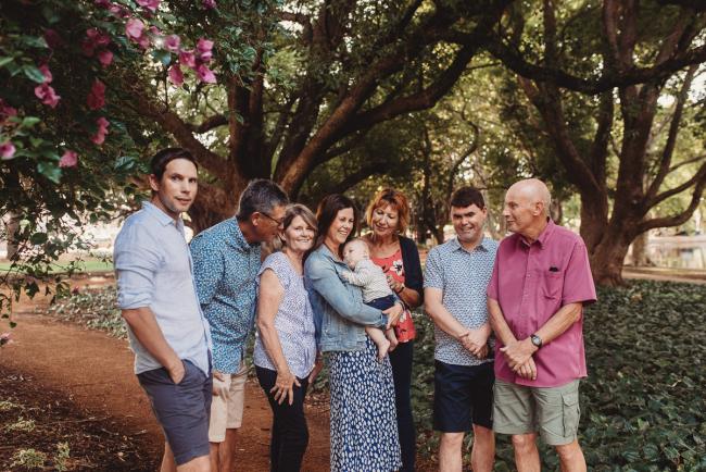 Baby with parents and grandparents during extended family session at Hyde Park with Perth family photographer Alana Prosper Photography