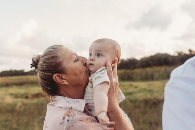 Grandmother kissing baby with Perth Family Photographer Alana Prosper Photography at Perry's Paddock