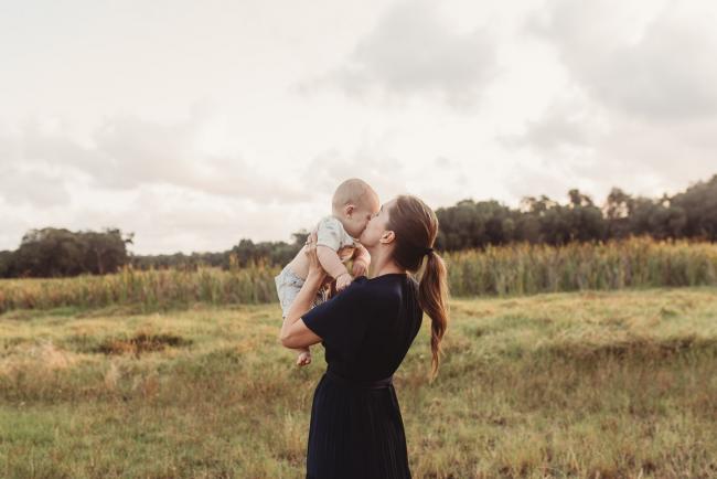 Mother kissing baby with Perth Family Photographer Alana Prosper Photography at Perry's Paddock