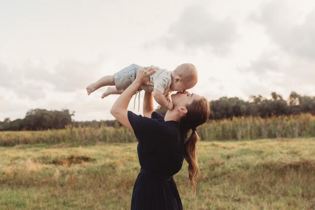 Mother kissing baby with Perth Family Photographer Alana Prosper Photography at Perry's Paddock