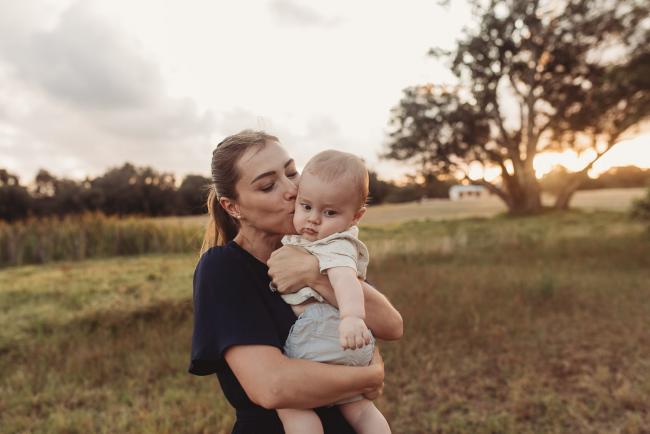 Mother kissing baby with Perth Family Photographer Alana Prosper Photography at Perry's Paddock