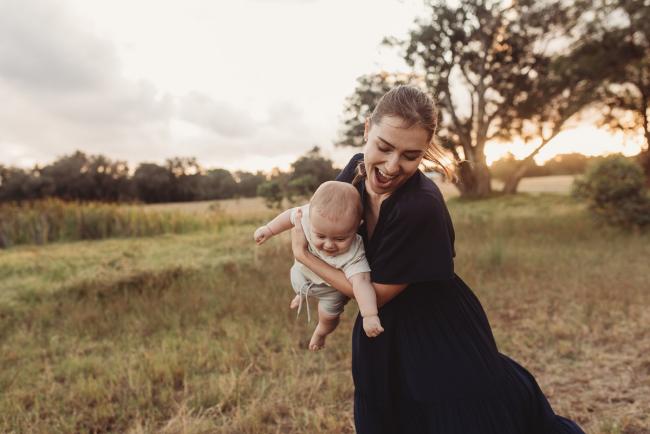 Mother flying baby with Perth Family Photographer Alana Prosper Photography at Perry's Paddock