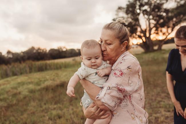 Grandmother kissing baby with Perth Family Photographer Alana Prosper Photography at Perry's Paddock
