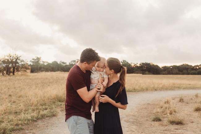 Parents holding baby with Perth Family Photographer Alana Prosper Photography at Perry's Paddock