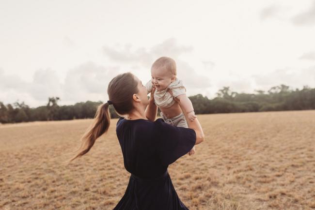 Mother spinning with baby with Perth Family Photographer Alana Prosper Photography at Perry's Paddock
