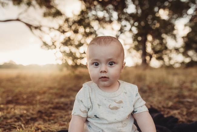 Baby looking at the camera with Perth Family Photographer Alana Prosper Photography at Perry's Paddock