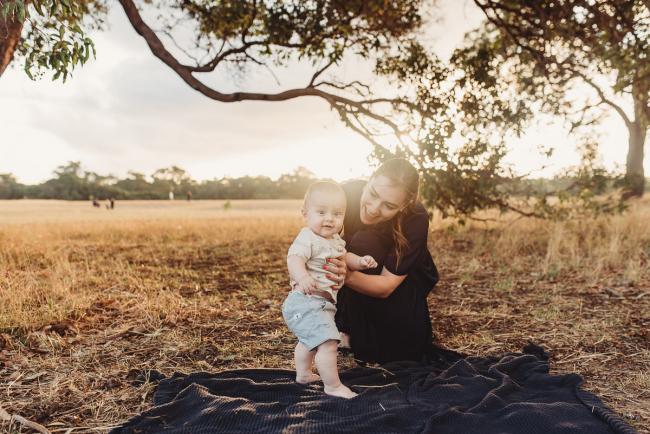 Mother holding baby in standing position on blanket with Perth Family Photographer Alana Prosper Photography at Perry's Paddock