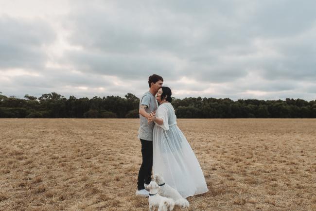 Couple dancing with Perth maternity photographer at Perry's Paddock