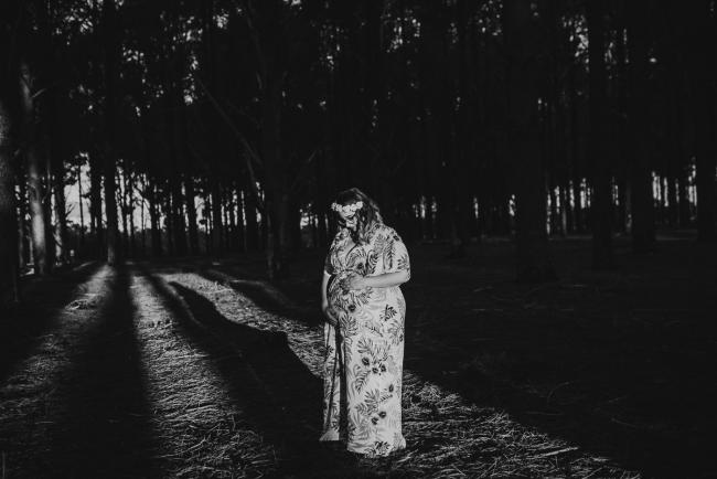 black and white image of pregnant woman in harsh light at The Pines with Perth maternity photographer Alana Prosper Photography