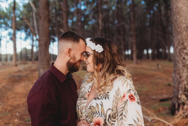 Couple touching foreheads at The Pines with Perth maternity photographer Alana Prosper Photography