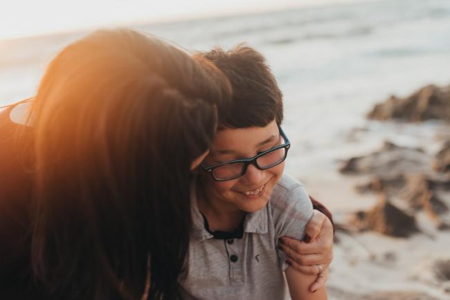 mother hugging son with Perth family photographer Alana Prosper Photography at Burns Beach