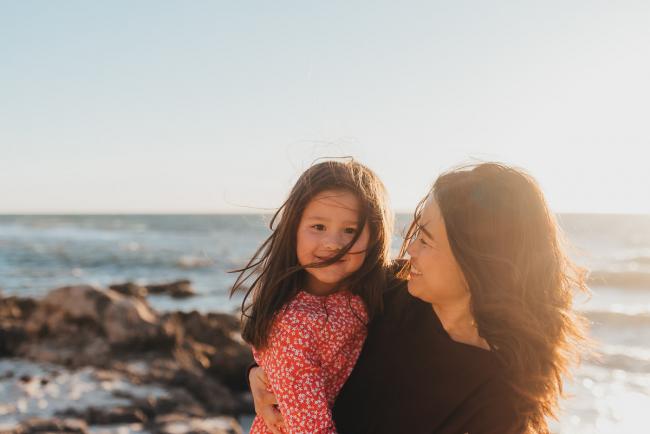 Mother and daughter laughing at Burns Beach with Perth Family Photographer