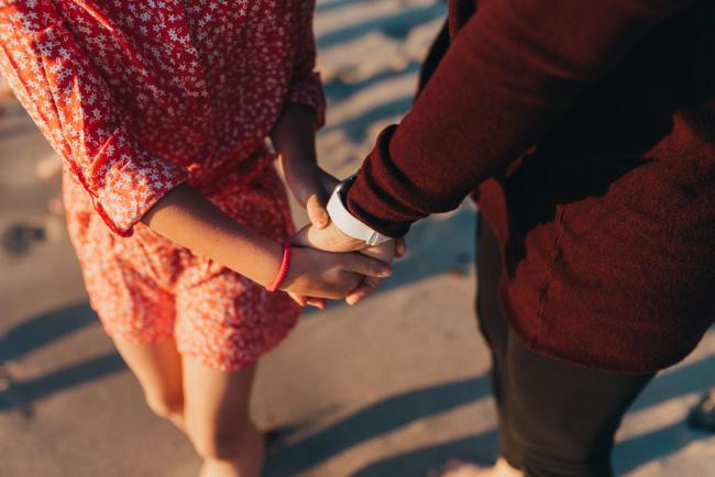 mother and daughter holding hands with Perth family photographer Alana Prosper Photography at Burns Beach