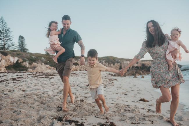 family of five running on the beach with family photographer Perth at Burns Beach, Alana Prosper Photography