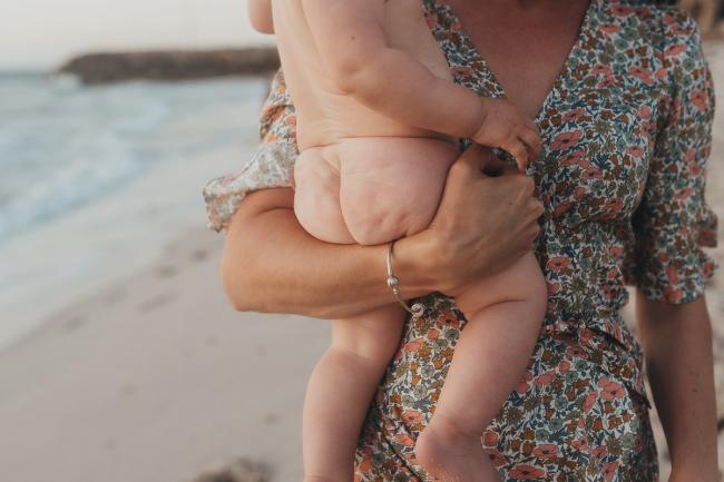 bare baby bottom on the beach with family photographer Perth at Burns Beach, Alana Prosper Photography