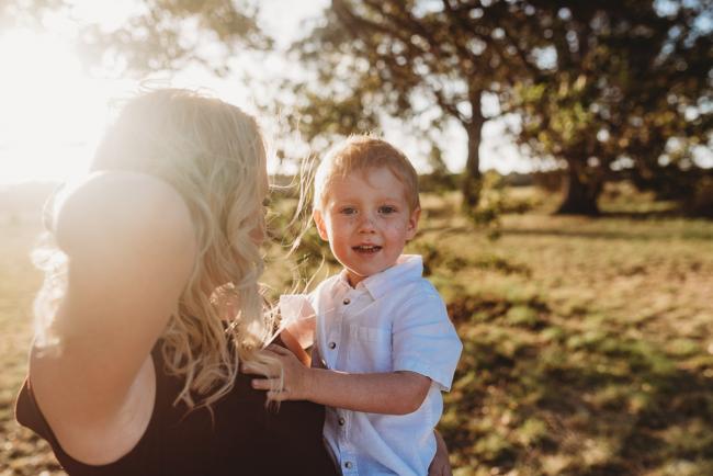 Mother holding son during golden hour at Perry's Paddock with Perth Family Photographer Alana Prosper Photography