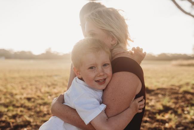 boys cuddling mother during golden hour at Perry's Paddock with Perth Family Photographer Alana Prosper Photography
