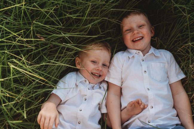 Boys laying in the grass during golden hour at Perry's Paddock with Perth Family Photographer Alana Prosper Photography