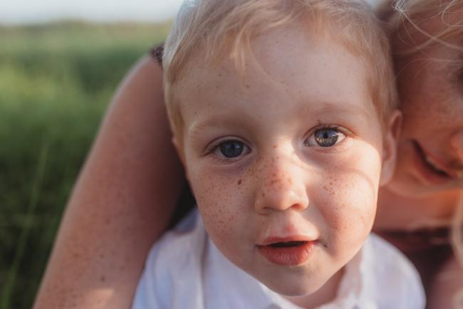 close up of little boy during golden hour at Perry's Paddock with Perth Family Photographer Alana Prosper Photography