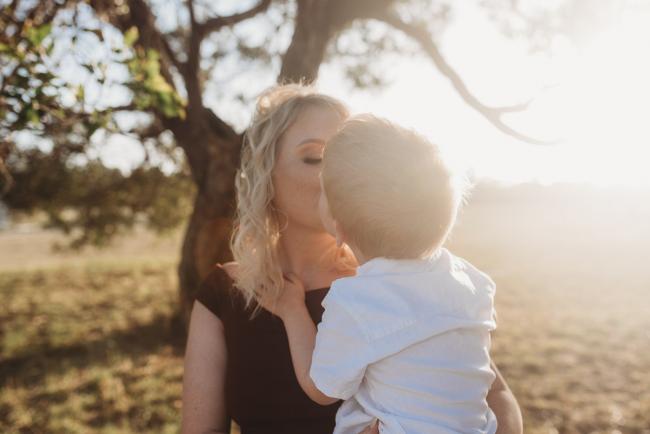 mother and son kissing during golden hour at Perry's Paddock with Perth Family Photographer Alana Prosper Photography